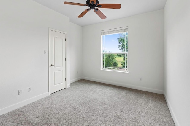 221 Mcgarity St, Kyle, TX 78640 - empty room featuring carpet flooring, baseboards, and a ceiling fan
