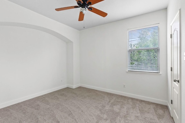 221 Mcgarity St, Kyle, TX 78640 - carpeted spare room with baseboards and a ceiling fan