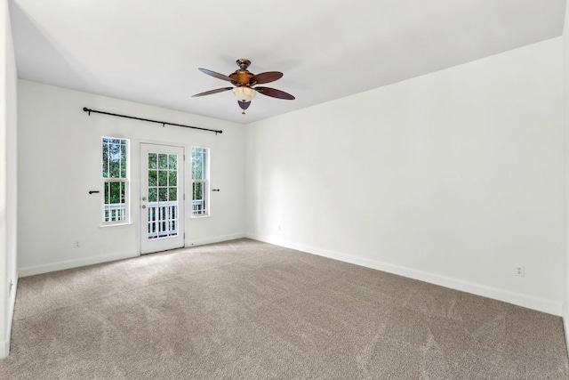 221 Mcgarity St, Kyle, TX 78640 - carpeted spare room with a ceiling fan and baseboards