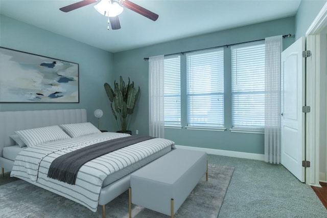 221 Mcgarity St, Kyle, TX 78640 - carpeted bedroom featuring baseboards and ceiling fan