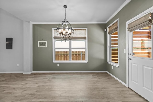 1913 Gabrielles Way, Manchaca, TX 78652 - unfurnished dining area featuring a chandelier, wood finished floors, ornamental molding, and baseboards
