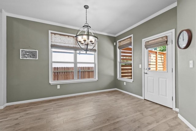 1913 Gabrielles Way, Manchaca, TX 78652 - unfurnished dining area featuring a chandelier, crown molding, wood finished floors, and baseboards