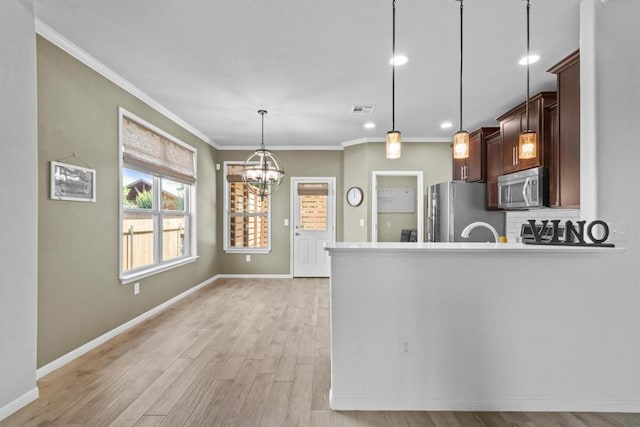 1913 Gabrielles Way, Manchaca, TX 78652 - kitchen featuring stainless steel appliances, crown molding, light wood-style floors, decorative backsplash, and a chandelier