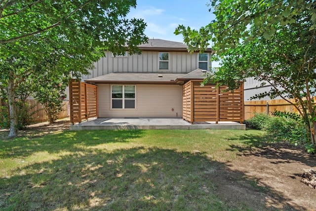 1913 Gabrielles Way, Manchaca, TX 78652 - back of property with board and batten siding and a patio area