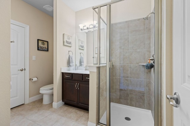 2337 Centennial Loop, Round Rock, TX 78665 - full bathroom with vanity, a shower stall, toilet, tile patterned flooring, and baseboards