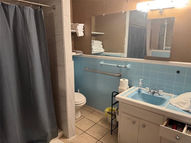 137 N Kowald Ln, New Braunfels, TX 78130 - bathroom featuring tile walls, vanity, tile patterned flooring, toilet, and a shower with curtain