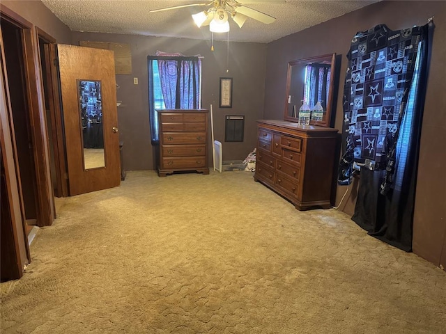 137 N Kowald Ln, New Braunfels, TX 78130 - bedroom featuring light carpet, a textured ceiling, and ceiling fan