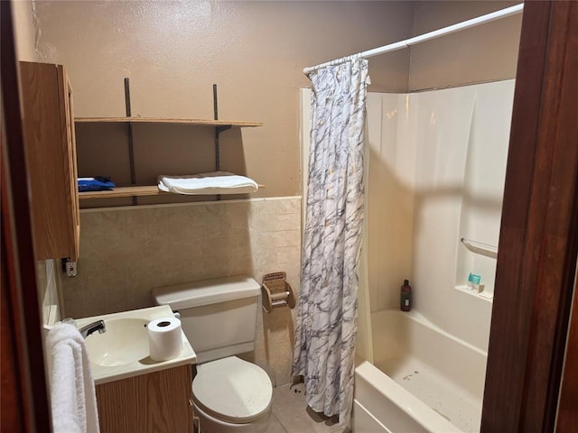 137 N Kowald Ln, New Braunfels, TX 78130 - bathroom with vanity, shower / bath combination with curtain, toilet, tile walls, and wainscoting