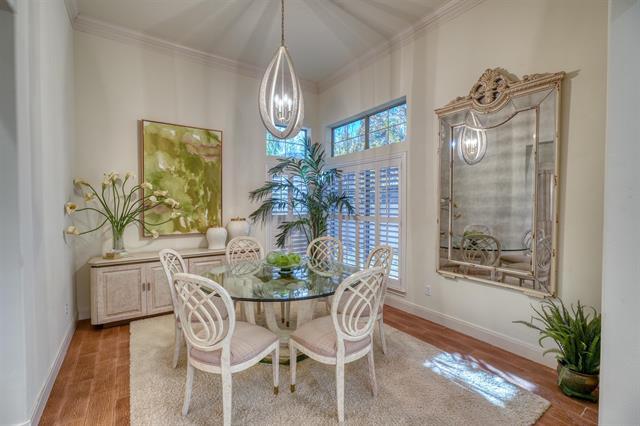 104 Mason Ct, Horseshoe Bay, TX 78657 - dining room with wood finished floors, crown molding, and baseboards
