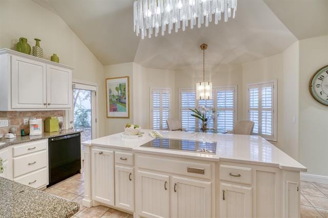 104 Mason Ct, Horseshoe Bay, TX 78657 - kitchen featuring black appliances, a chandelier, light tile patterned flooring, white cabinets, and lofted ceiling