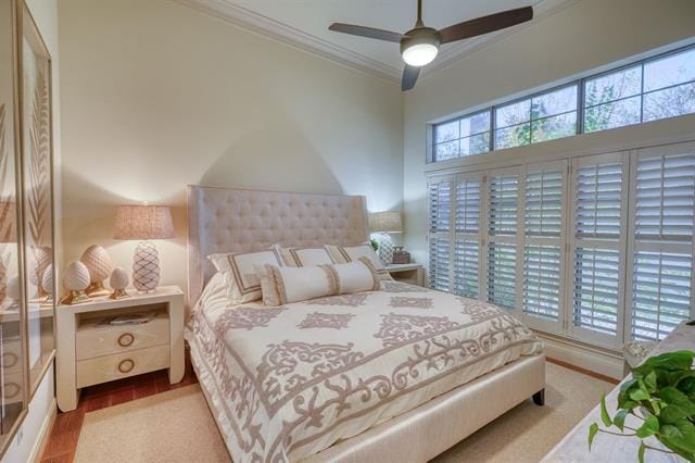 104 Mason Ct, Horseshoe Bay, TX 78657 - bedroom featuring crown molding and a ceiling fan
