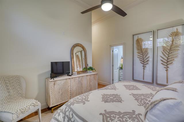 104 Mason Ct, Horseshoe Bay, TX 78657 - bedroom featuring ornamental molding, baseboards, a ceiling fan, and wood finished floors