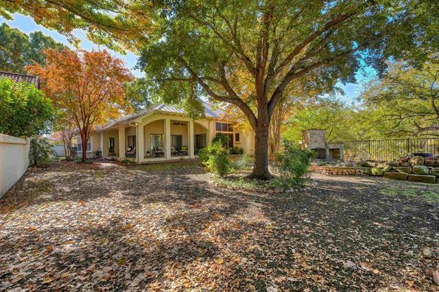 104 Mason Ct, Horseshoe Bay, TX 78657 - rear view of property featuring stucco siding