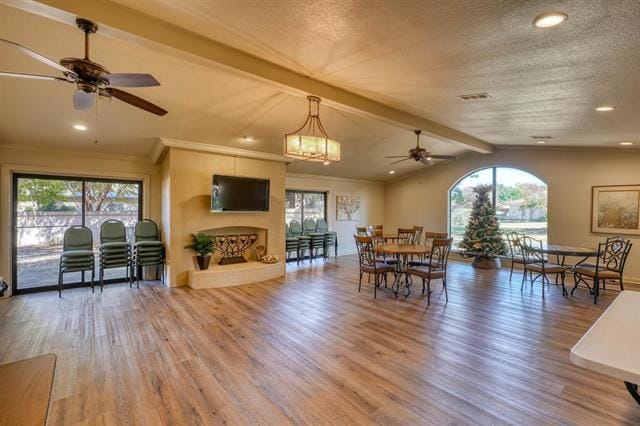 104 Mason Ct, Horseshoe Bay, TX 78657 - dining room featuring ceiling fan, wood finished floors, healthy amount of natural light, recessed lighting, and ornamental molding