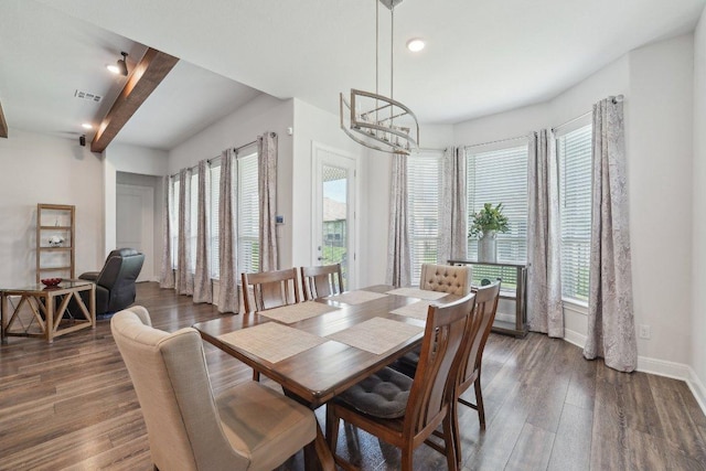 3113 Capra Cv, Round Rock, TX 78665 - dining space with healthy amount of natural light, dark wood finished floors, baseboards, recessed lighting, and a chandelier