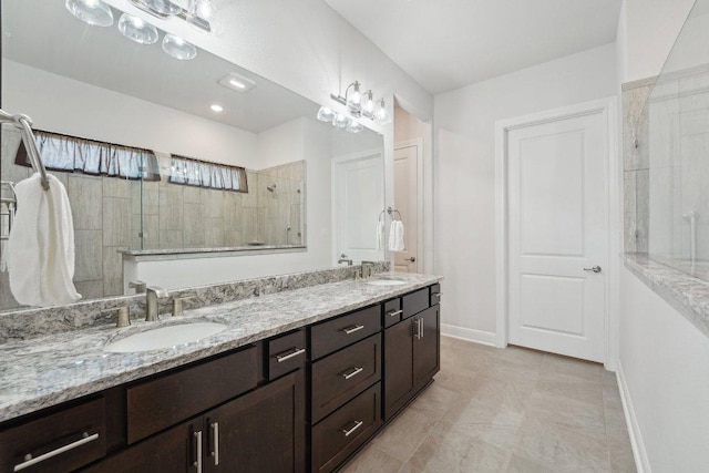 3113 Capra Cv, Round Rock, TX 78665 - bathroom with double vanity, tiled shower, and baseboards