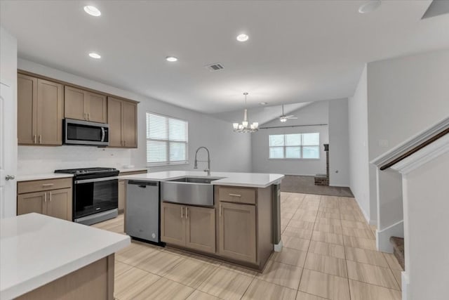308 Castlefields St, Hutto, TX 78634 - kitchen featuring appliances with stainless steel finishes, healthy amount of natural light, light countertops, and recessed lighting
