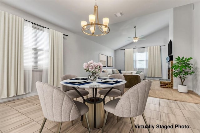 308 Castlefields St, Hutto, TX 78634 - dining space featuring a chandelier, vaulted ceiling, and ceiling fan