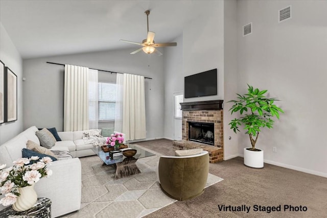 308 Castlefields St, Hutto, TX 78634 - carpeted living room with ceiling fan, a brick fireplace, and high vaulted ceiling