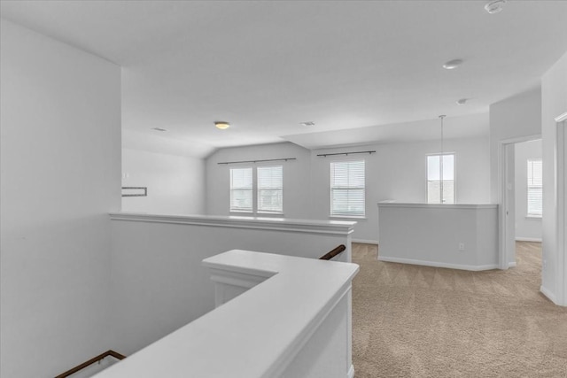 308 Castlefields St, Hutto, TX 78634 - corridor with an upstairs landing, light colored carpet, healthy amount of natural light, and lofted ceiling