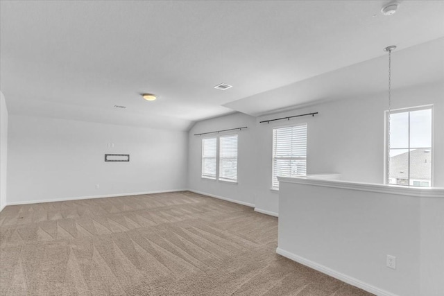 308 Castlefields St, Hutto, TX 78634 - unfurnished room with light carpet, a smoke detector, and lofted ceiling