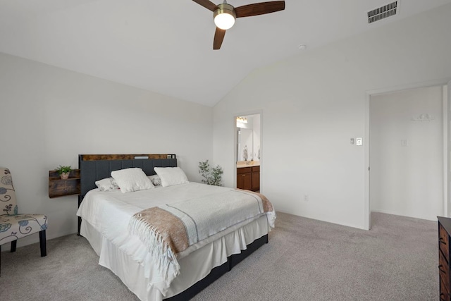 311 Spiny Lizard Ln, San Marcos, TX 78666 - bedroom with light carpet, vaulted ceiling, ceiling fan, and connected bathroom