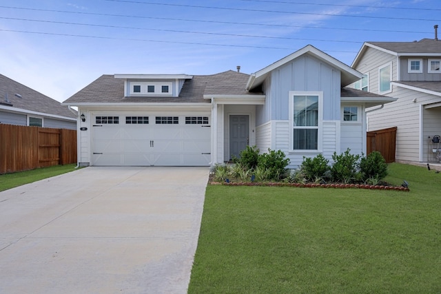 311 Spiny Lizard Ln, San Marcos, TX 78666 - single story home featuring a garage, concrete driveway, board and batten siding, and a shingled roof