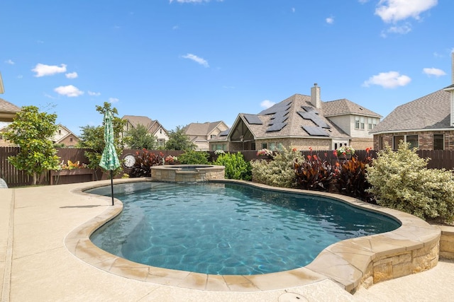 19325 Tristan Stone Dr, Pflugerville, TX 78660 - view of pool featuring a residential view, a fenced backyard, and a pool with connected hot tub