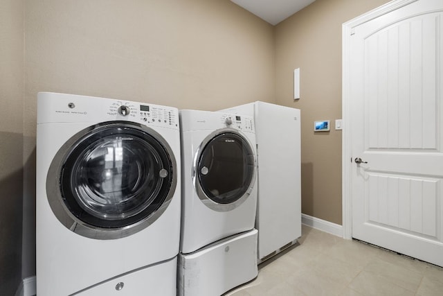 19325 Tristan Stone Dr, Pflugerville, TX 78660 - laundry area with separate washer and dryer and baseboards