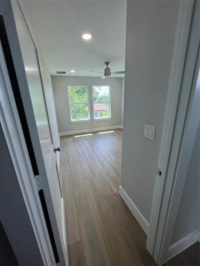 401 E Carrie St, Manor, TX 78653 - corridor with wood finished floors and recessed lighting