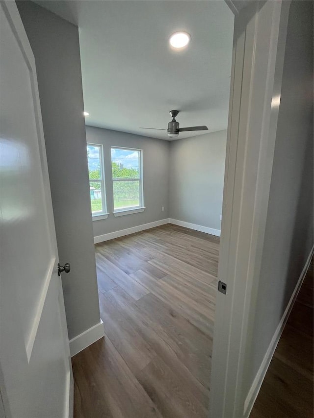 401 E Carrie St, Manor, TX 78653 - spare room featuring wood finished floors, a ceiling fan, and recessed lighting