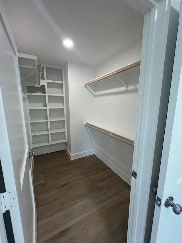 401 E Carrie St, Manor, TX 78653 - walk in closet featuring wood finished floors