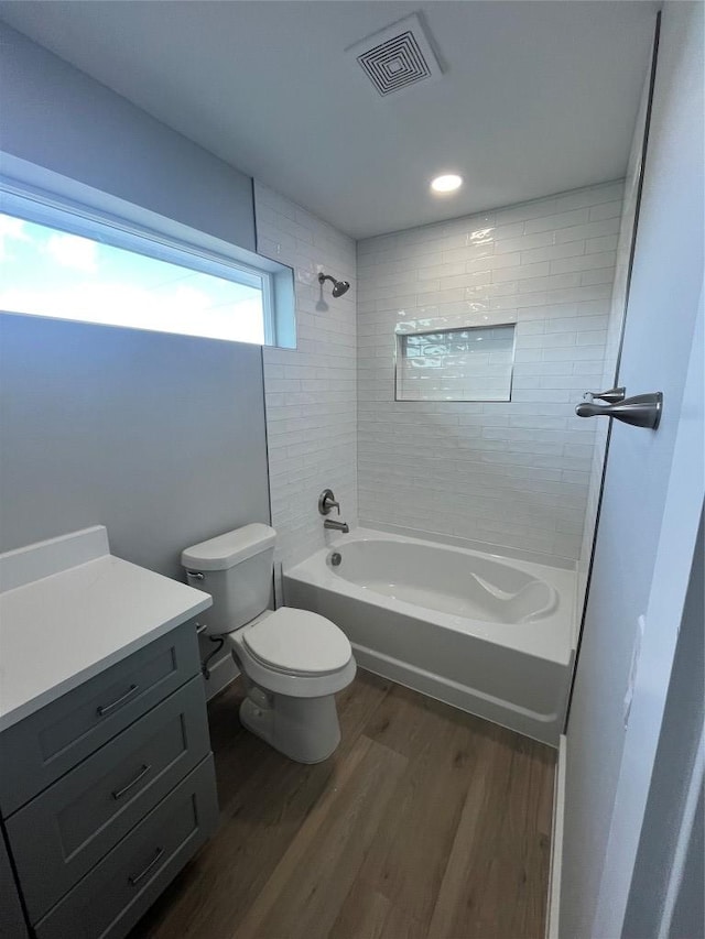 401 E Carrie St, Manor, TX 78653 - full bathroom with wood finished floors, shower / bath combination, vanity, and recessed lighting