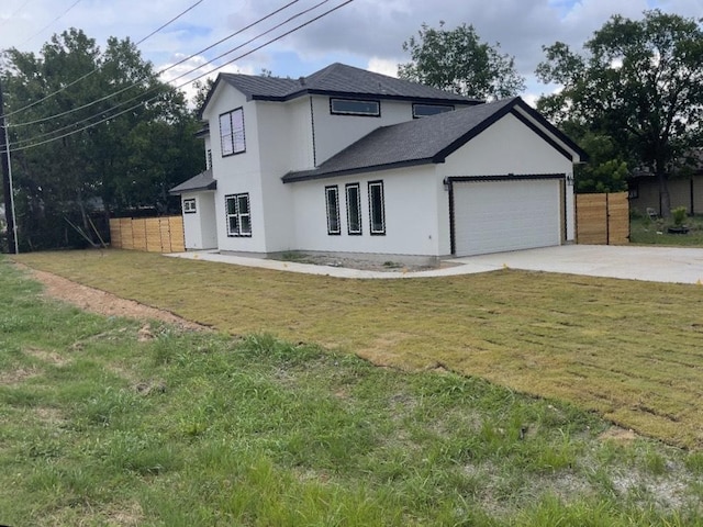 401 E Carrie St, Manor, TX 78653 - view of front of property featuring a garage, concrete driveway, a shingled roof, and stucco siding