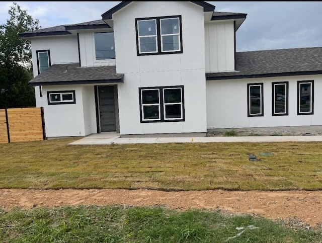 401 E Carrie St, Manor, TX 78653 - view of front of house with a shingled roof and stucco siding
