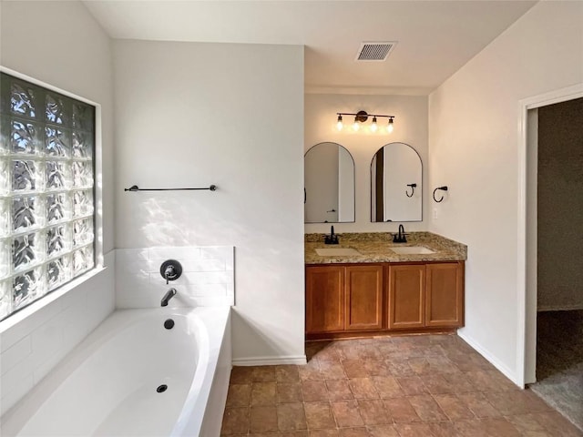18132 Great Basin Ave, Pflugerville, TX 78660 - full bath featuring double vanity and a garden tub