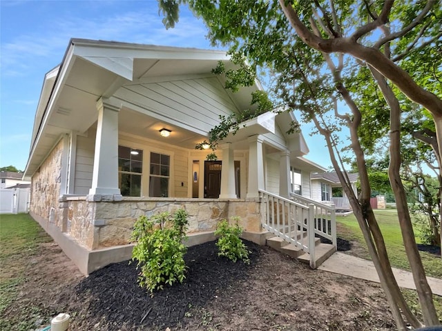 18132 Great Basin Ave, Pflugerville, TX 78660 - view of front facade featuring a porch and stone siding