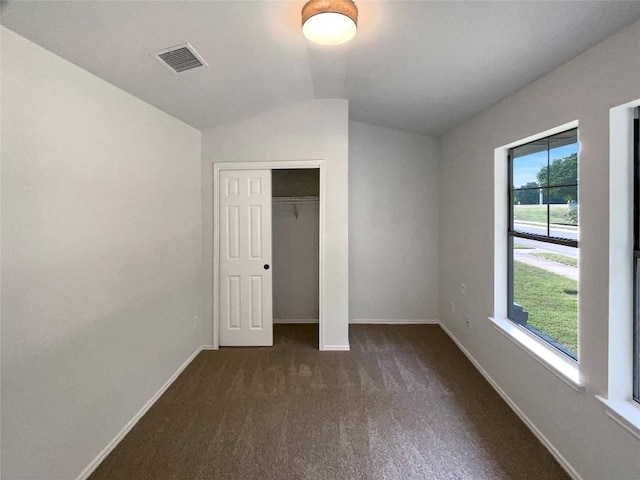 18132 Great Basin Ave, Pflugerville, TX 78660 - unfurnished bedroom with lofted ceiling, dark carpet, and a closet