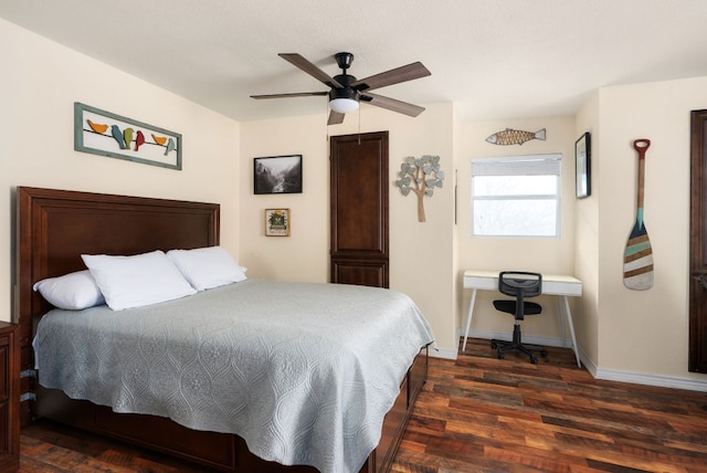 235 El Camino River Rd, Bastrop, TX 78602 - bedroom with dark wood-style flooring and ceiling fan
