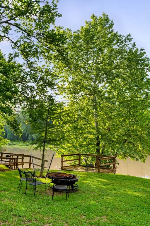 235 El Camino River Rd, Bastrop, TX 78602 - view of property's community with a fire pit and a lawn