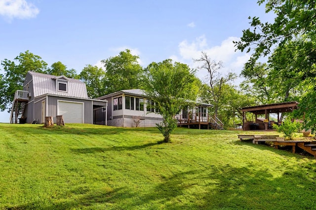 235 El Camino River Rd, Bastrop, TX 78602 - view of green lawn with stairs, a garage, and a deck