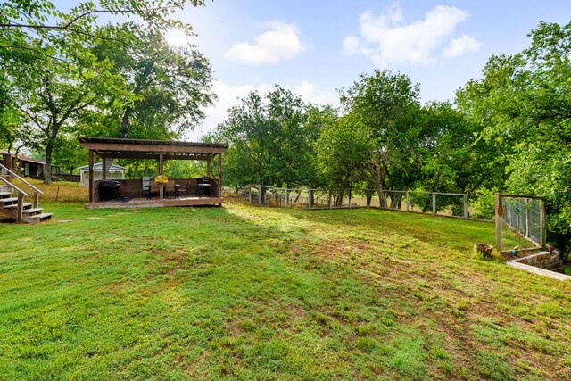 235 El Camino River Rd, Bastrop, TX 78602 - view of yard featuring a wooden deck