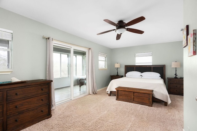 235 El Camino River Rd, Bastrop, TX 78602 - bedroom featuring access to exterior, carpet, and ceiling fan