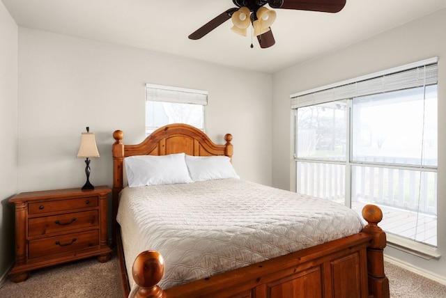 235 El Camino River Rd, Bastrop, TX 78602 - carpeted bedroom featuring baseboards and ceiling fan