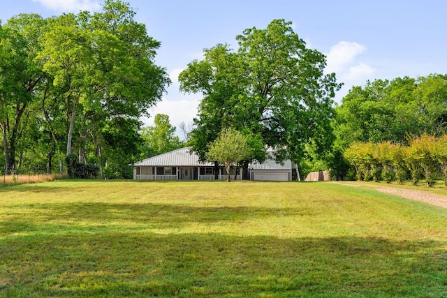 235 El Camino River Rd, Bastrop, TX 78602 - view of grassy yard with a detached garage