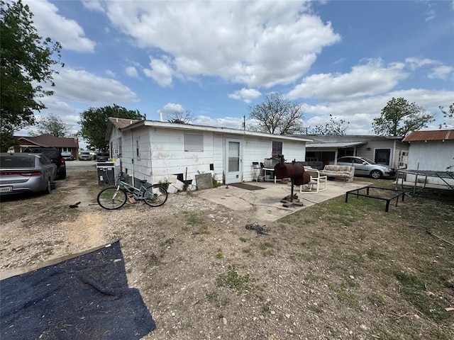 142 N Kowald Ln, New Braunfels, TX 78130 - back of property with a patio area