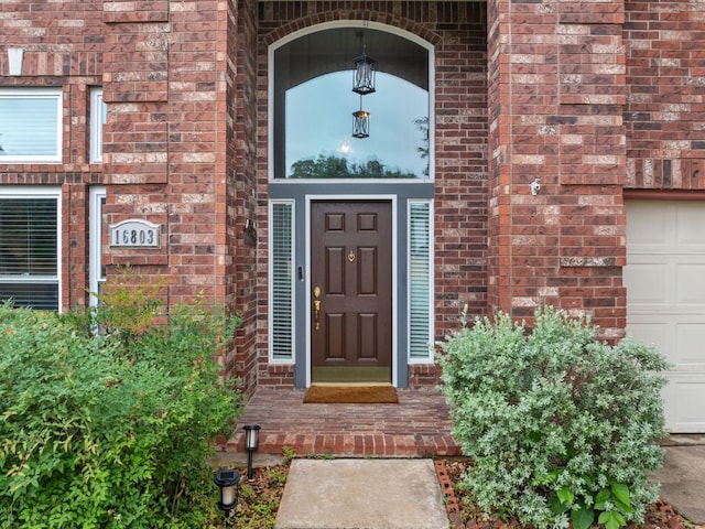 16803 Black Kettle Dr, Leander, TX 78641 - property entrance featuring brick siding and a garage