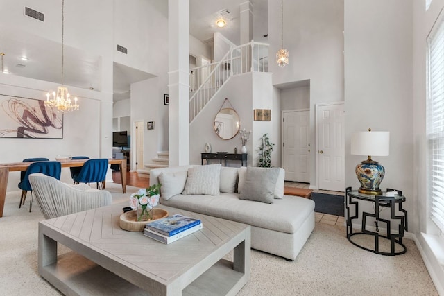16803 Black Kettle Dr, Leander, TX 78641 - living area featuring a chandelier, a towering ceiling, and stairs
