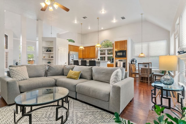 16803 Black Kettle Dr, Leander, TX 78641 - living room with high vaulted ceiling, a ceiling fan, light wood-style flooring, and healthy amount of natural light
