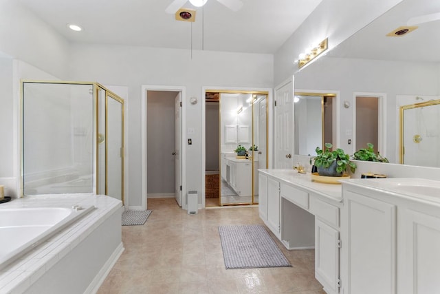16803 Black Kettle Dr, Leander, TX 78641 - full bathroom with double vanity, a shower stall, a garden tub, a ceiling fan, and tile patterned flooring